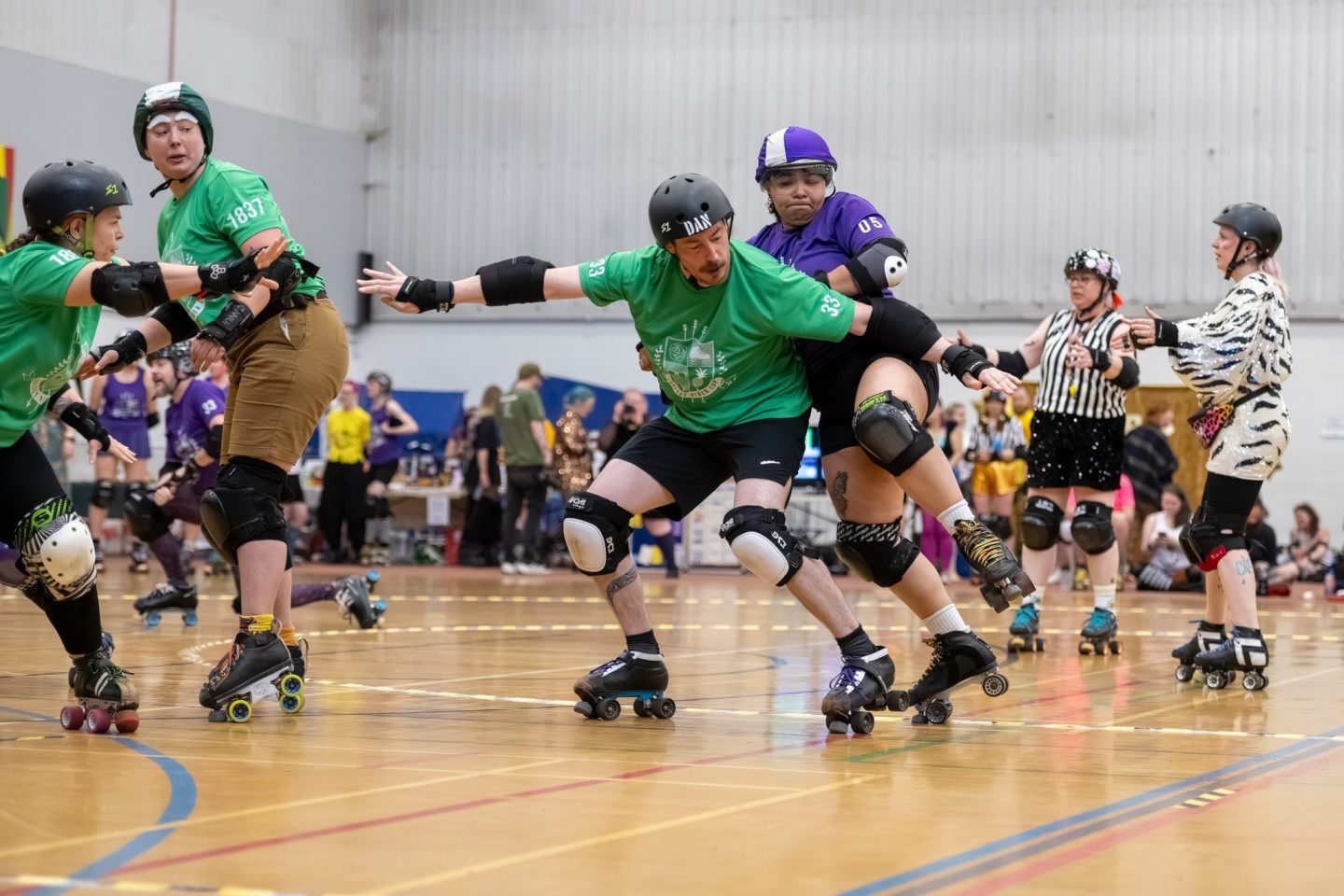 A group of roller derby players taking part in a tournament.