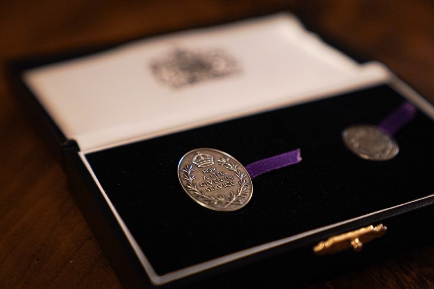 The Elizabeth Emblem in a presentation case.