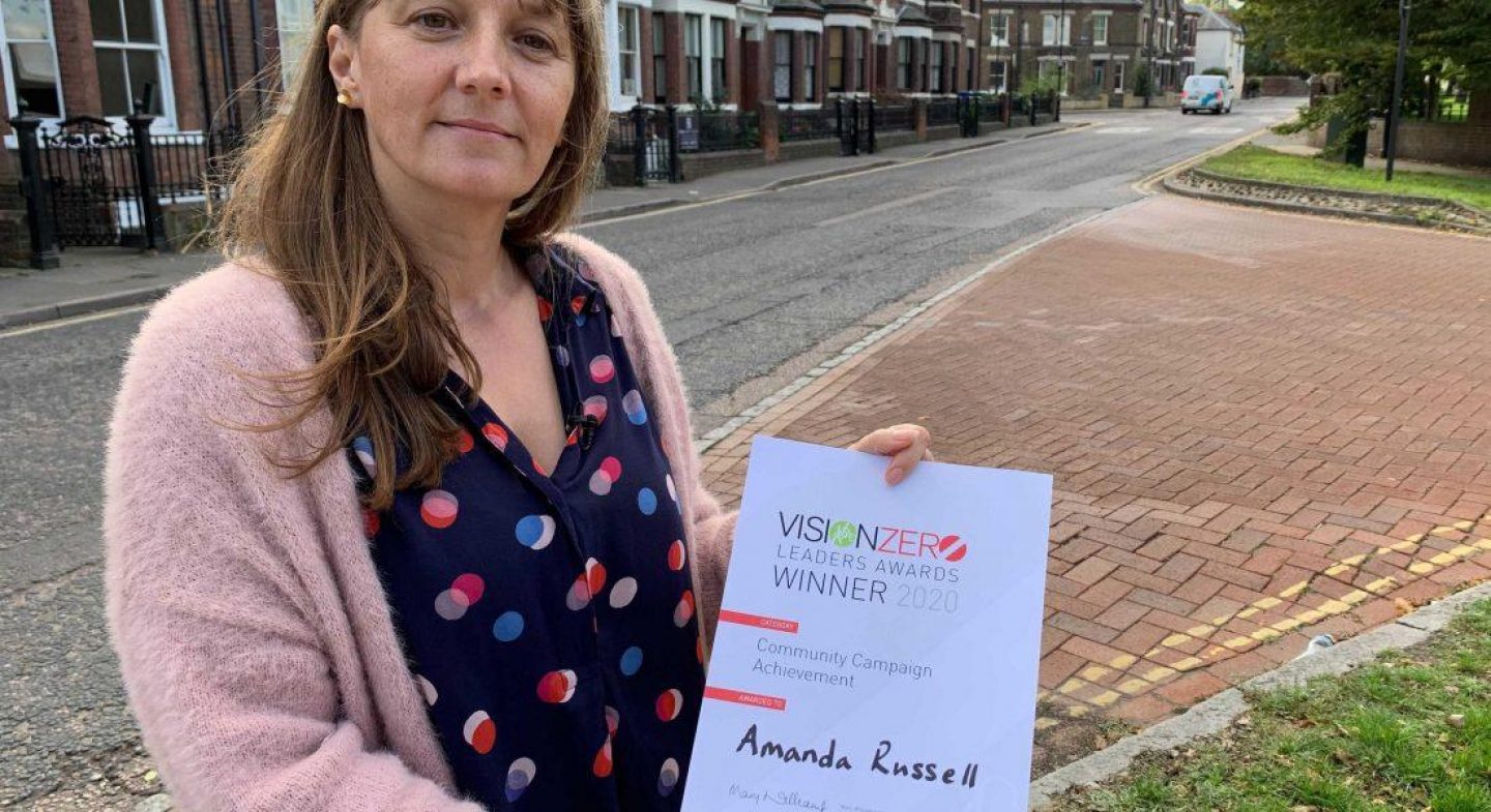 Amanda Russell holding award