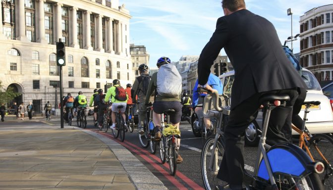 Bicycle commuters in a cycle lane in London, after crossing Blackfriars Bridge