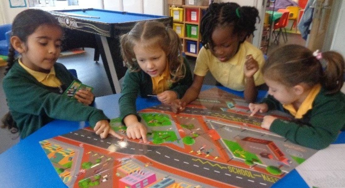A group of young children are taking part in road safety games.