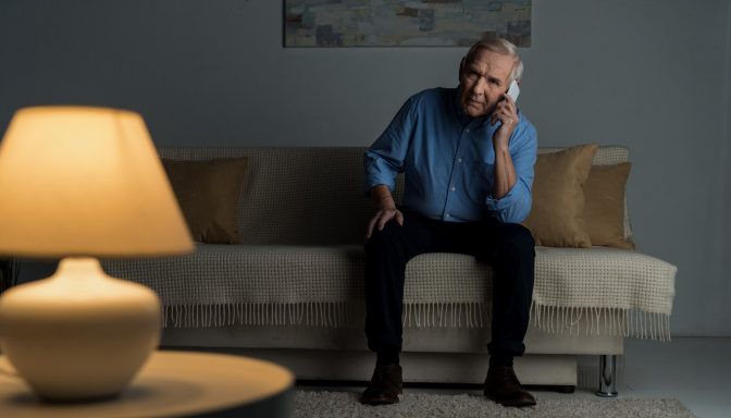 Man on sofa on phone